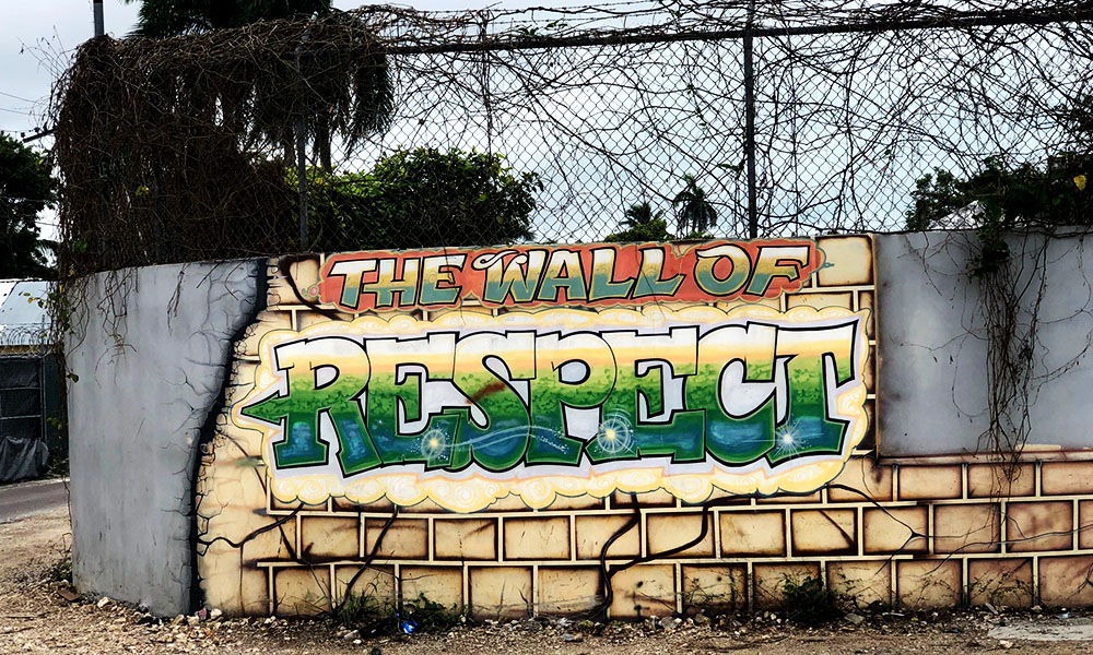 An old wall inland Bahamas is decorated with skilled graffiti: THE WALL OF RESPECT