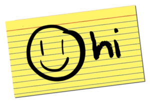 smiley face and 'hi' written on yellow index card