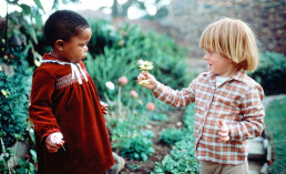 flower children interracial kids playing black white
