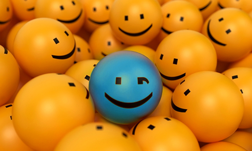 winking blue smiley surrounded by yellow smileys